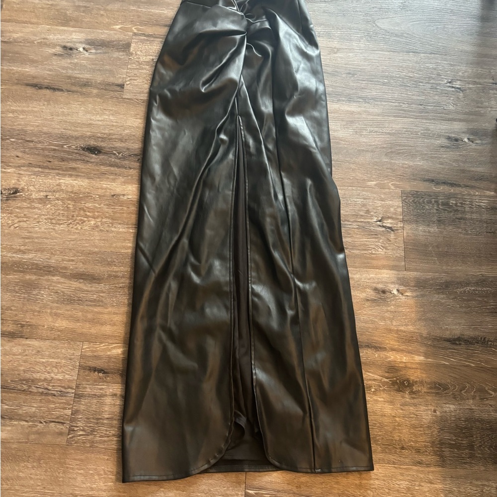 Black vegan leather midi skirt with twist detail at front